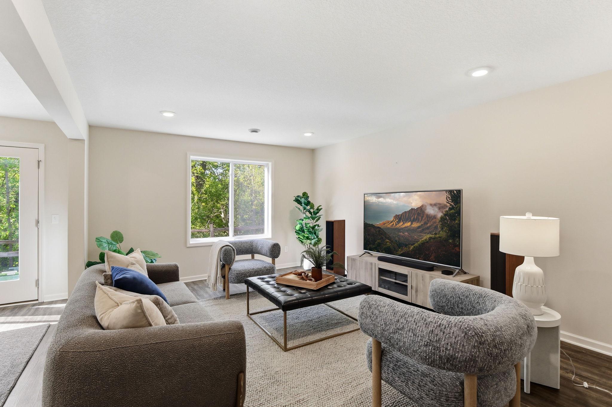 Lower level family room is well lit