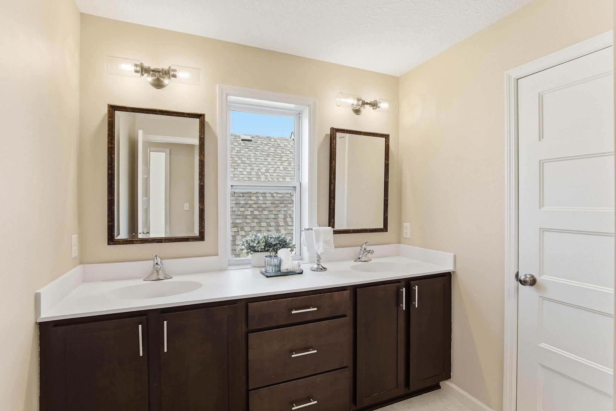Full bath has double sink vanity
