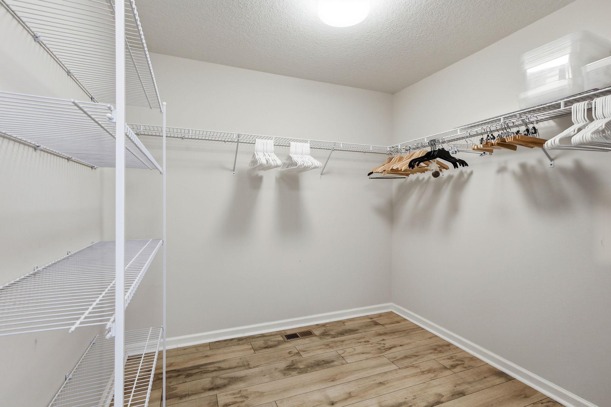 Walk-in closet with organizer and space