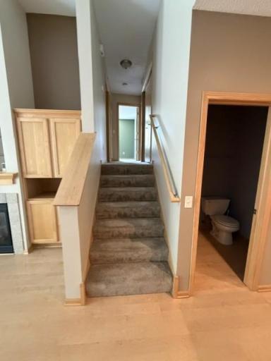 Stairs lead to two bedroom, two baths and laundry area