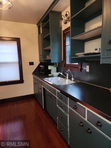 Renovated kitchen, stainless steel sink, replaced counters, newly refurbished wood floors and door, stainless steel appliances