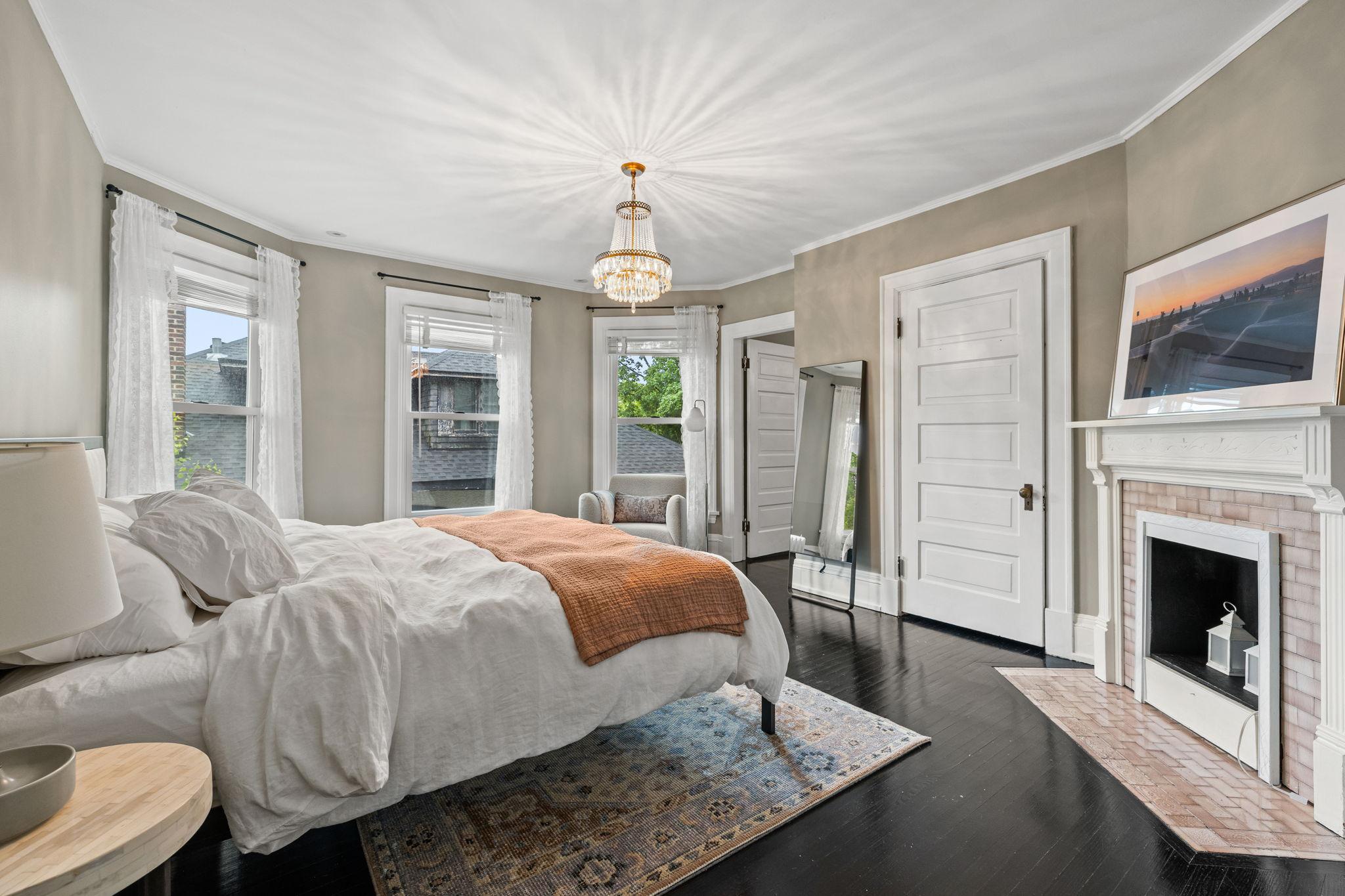 Bedroom 2 with bay window and decorative fireplace