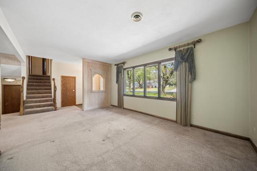 From living room with sunny window and electric fireplace