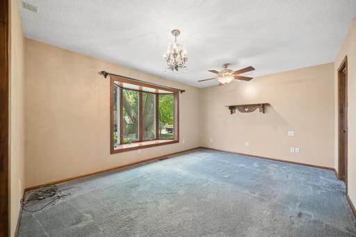 Primary Bedroom with walk in closet and bay window