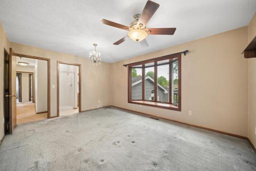 Primary bedroom with 3/4 bath and walk in closet