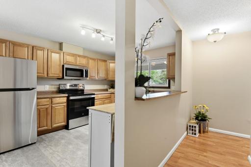 Pretty archway into the west facing kitchen- Bright and plenty of countertop!
