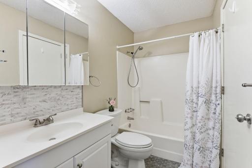 Main Floor bath walk-thru to primary BR. Very Nice finishes- even a new showerhead!