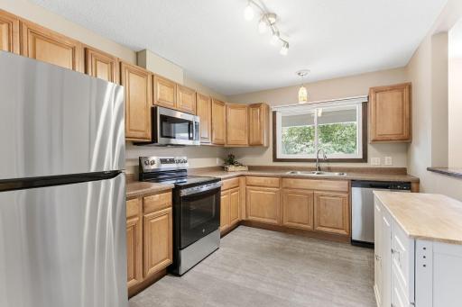 Wonderful open kitchen- SUPER CLEAN. Lots of newer appliances- new blinds, newer fixtures. All FRESH.