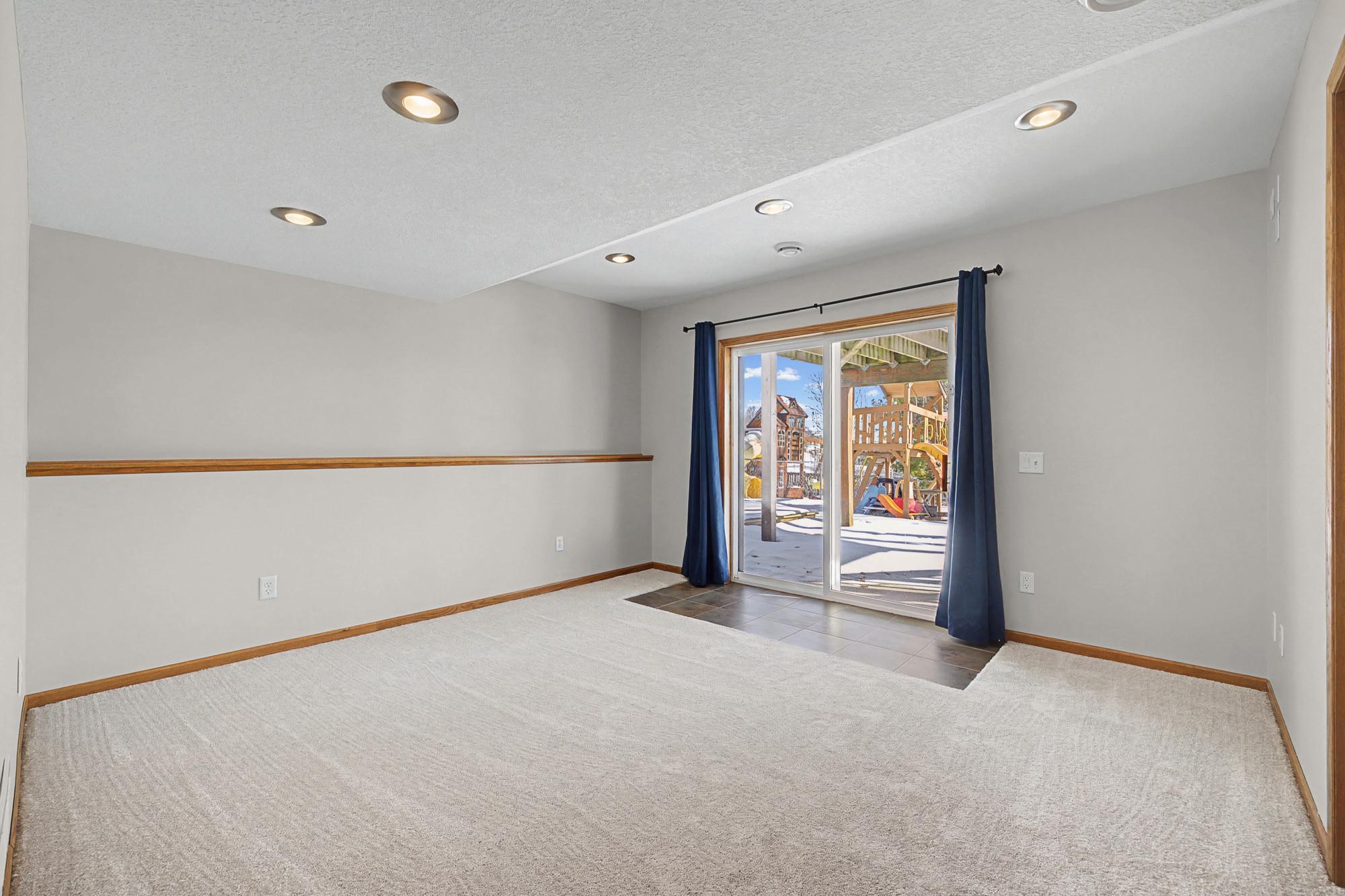 Lower Walkout family room with new carpet