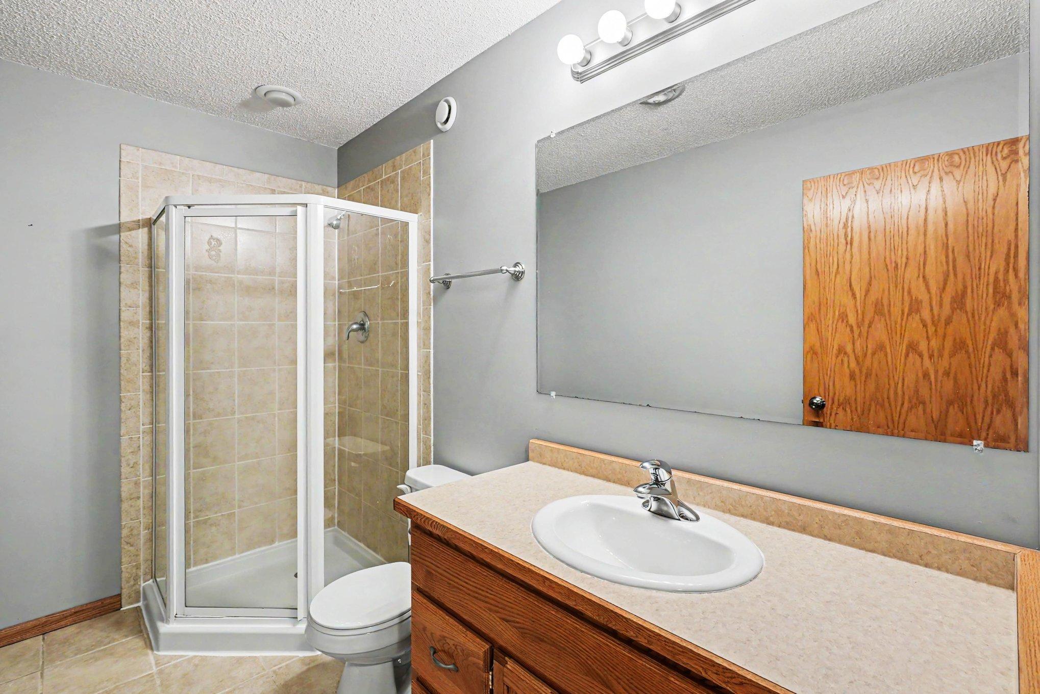 Basement 3/4 bath with tile shower