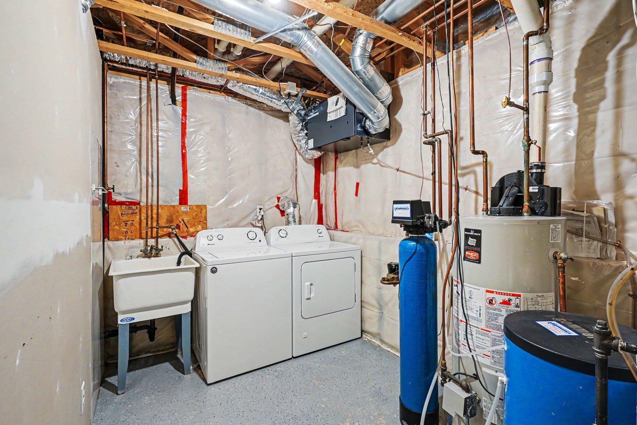 Utility room with washer, dryer, water softner and New furnace in 2025