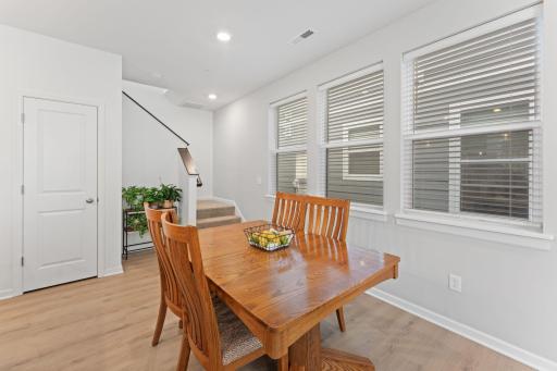 Dining room and stairs leading to bedrooms/laundry