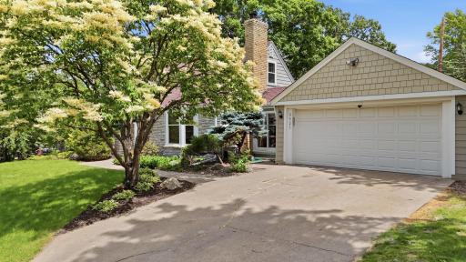 2 car garage with connecting sunporch to home