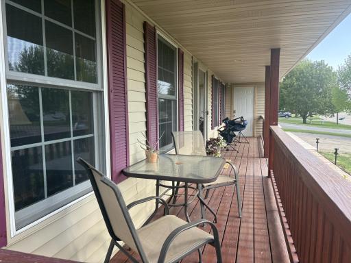 On the front of the home is this classic front porch perfect for greeting the neighborhood.