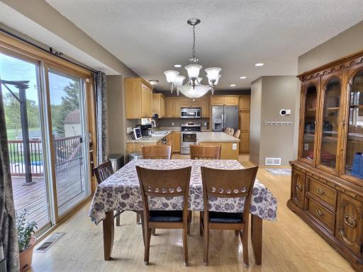 Dining area provides a great view of the back yard and easy access to the deck for grilling.