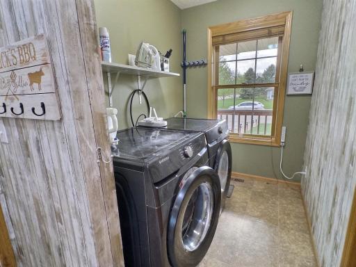 Main level laundry that includes a large closet currently being used a pantry.