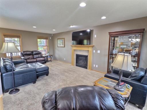 The main level boasts an inviting living room with a cozy gas fireplace with plenty of space to entertain family and friends.