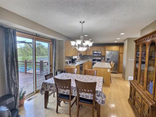 An open-concept kitchen, and a dining area that seamlessly connects to the backyard oasis
