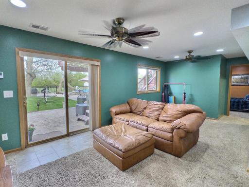 The finished lower level includes an additional bedroom, full bathroom, and a spacious great room with walkout access to the backyard.