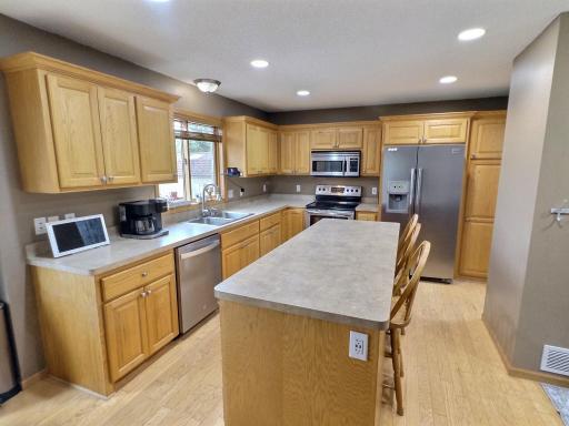 The kitchen offers ample counter and cabinet space and opens to the main living area, allowing the chef to stay part of the conversation.