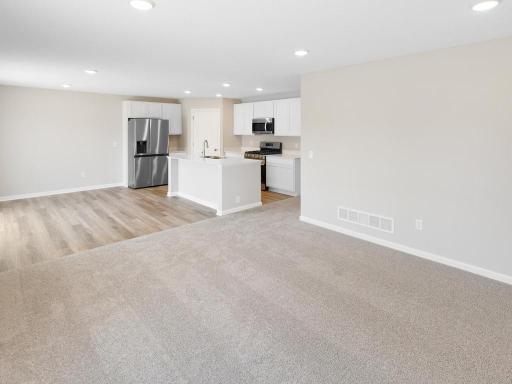 Open Concept. Photo taken of another home with similar plan and finishes. Photos and renderings may not depict actual plan, materials, & finishes may vary. All measurements are approximate.