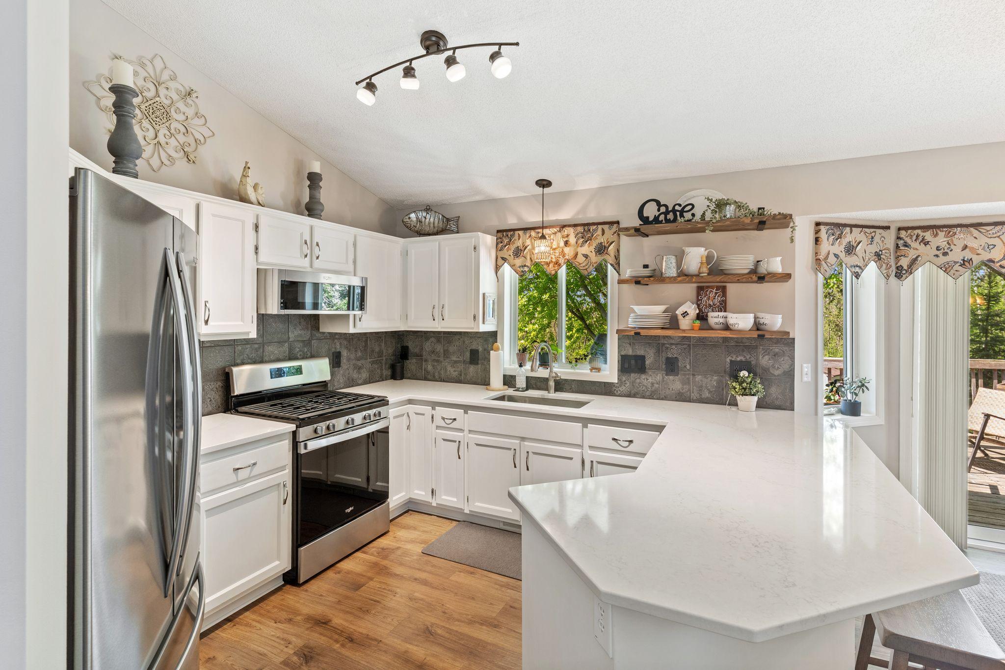 Completely updated with new cabinets, countertops, backsplash and SS appliances.