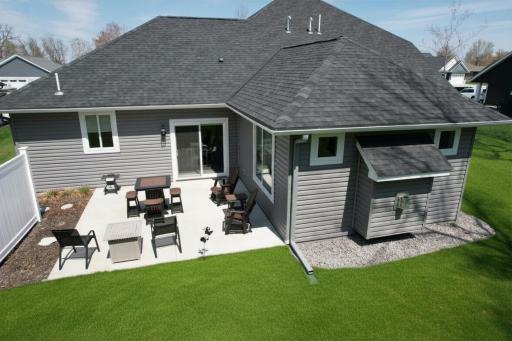 Private back patio with a half privacy fence, perfect for relaxing and enjoying the outdoors.