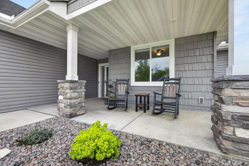 Charming covered porch entry with great curb appeal.