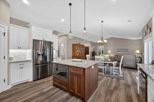 Oversized kitchen center island featuring a built-in microwaveâcombining style, functionality, and everyday convenience.
