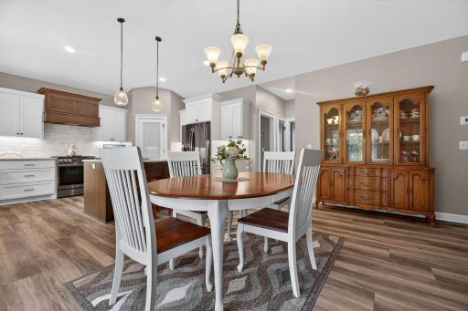 Informal dining area featuring a custom-built table designed to complement the homeâs woodwork and cabinetryâbeautifully coordinated and included with the sale.