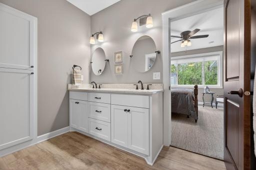 Ensuite - Spa-inspired ensuite featuring double sinks, deep linen cabinetry, and a private toilet roomâdesigned for comfort, storage, and everyday ease.