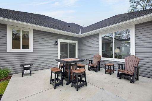 Step through the dining room doors onto a sprawling concrete patio perfectly positioned to soak in sweeping views of the heavily wooded lot â your private outdoor retreat awaits.