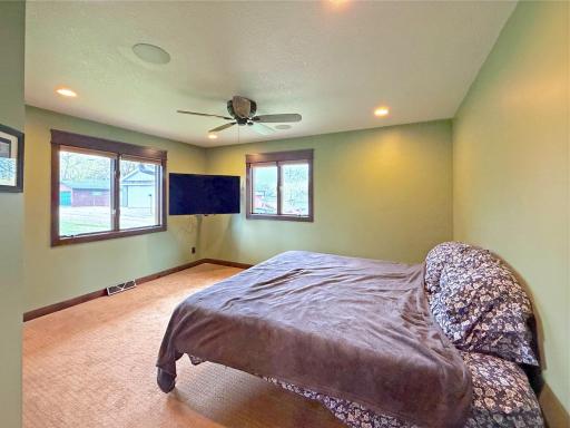 Primary suite features double windows designed for refreshing summer cross-breezes