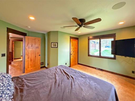The spacious primary bedroom has walk in closet and ceiling fan.