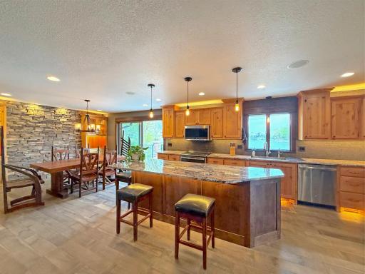 Spacious kitchen with a large center island with seating, both functional and social.