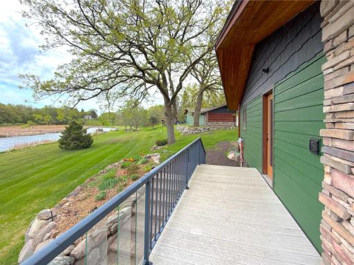 The side entrance to the deck and home offers both convenience and enhanced functionality for daily living.