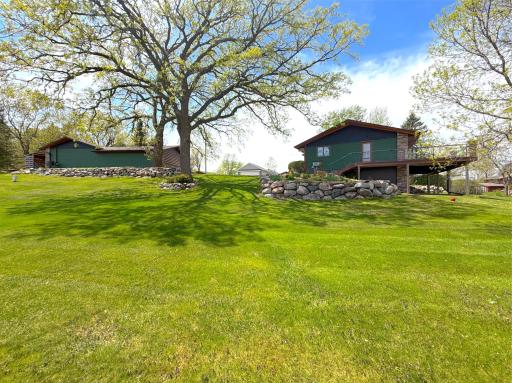 Beautiful boulder landscaping and mature trees throughout the property adds natural charm and character.