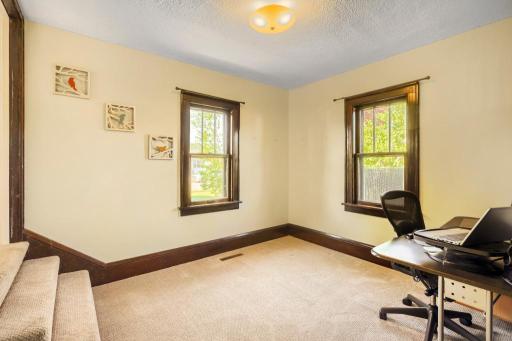 Main level bedroom offers the perfect space for guests, a home office, or flex room to fit your needs.