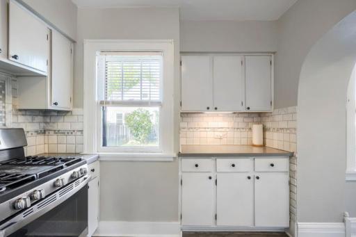 Corian countertops and stylish backsplash