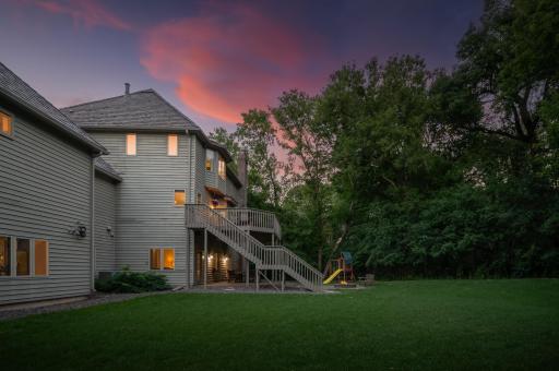 Steps from the deck to ground level offers easy access to the backyard privacy