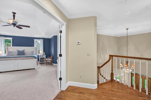 Welcome to the primary bedroom by double doors and multiple windows