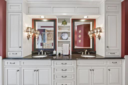 Whats not to love about this Vanity with (2) linen cabinets, lots of storae, separated sinks each with a mirror above and detail above that.