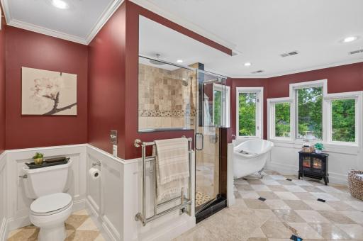 Additional views of primary bedroom bath with all the details, including the walk-in shower and separate free standing tub surrounded by windows
