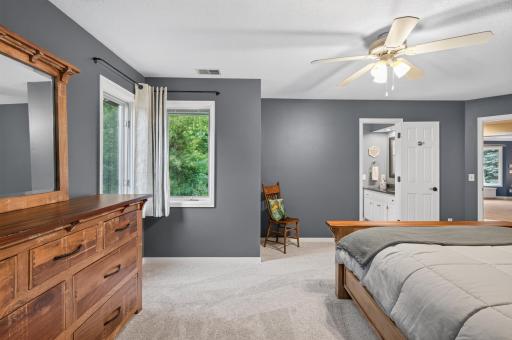 Corner windows in this bedroom, sized to supported well sized furniture, and step into bathroom from the bedroom