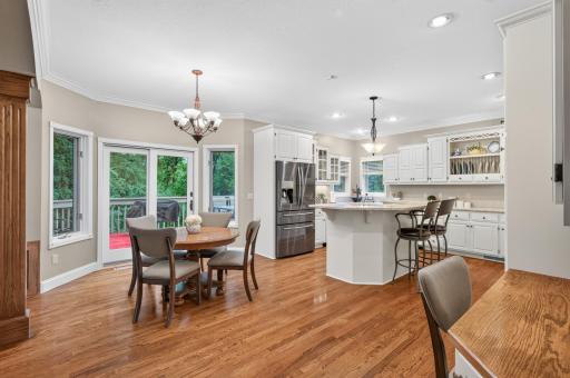 Chef/ Bakers dream kitchen. Functional lay-out with raised countertop center island. Wood Floors throughout, stainless steele appliances, and dual windows above corner kitchen sink
