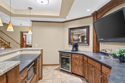 Tiled bar floor, space for microwave built in and sink