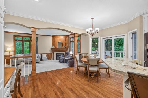 Dinette has bayed window/ patio door- walks out to a generous sized deck overlooking treed backyard
Openness to the family room with fireplace