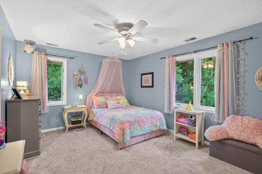 Sized to sleep and play in this bedroom with separate window allowing light to shine in from different light exposures