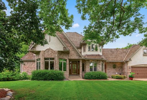 Lush Green yard with sprinkler system and additional landscaping around the home.