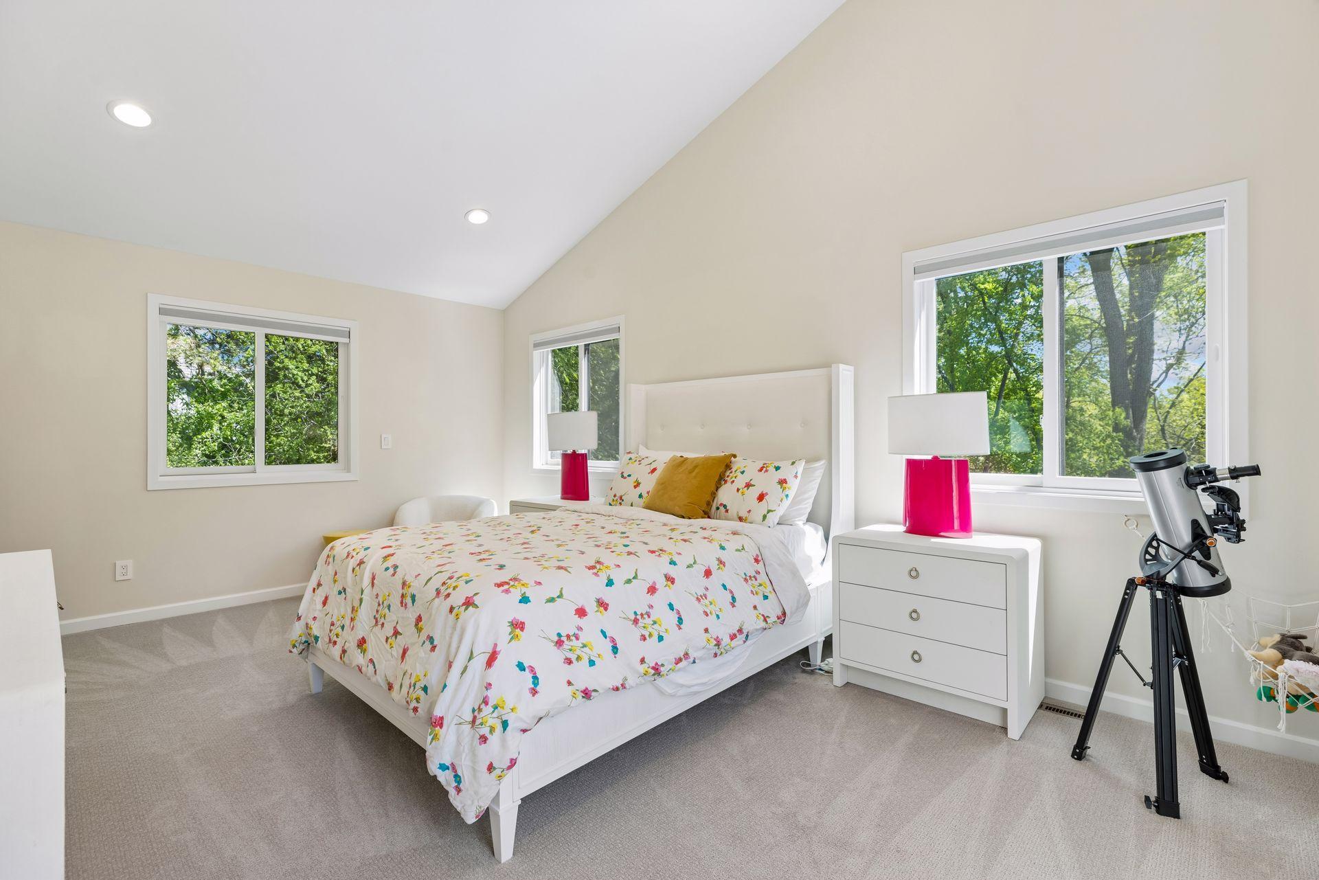 Three additional bedrooms, three bathrooms, secondary laundry, and rooftop sundecks complete the upper level.